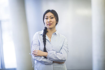 Young asia woman with paper in an office standing