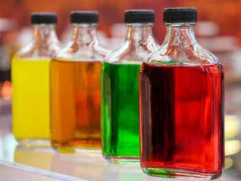 Close-up of beer in glass bottle on table
