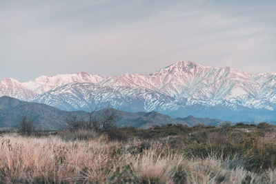 Scenic view of snowcapped mountains against sky