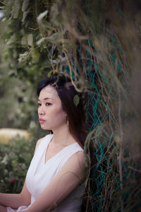 Portrait of young woman looking away