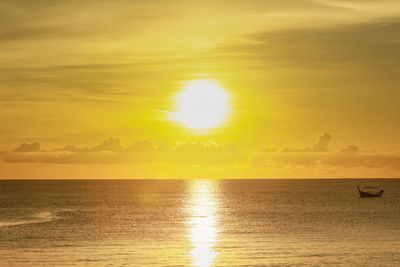 Scenic view of sea against orange sky