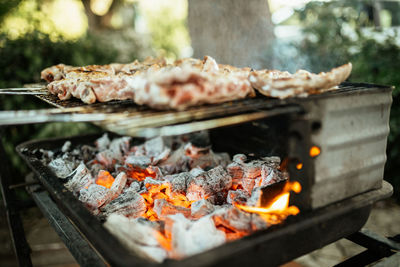 Close-up of meat on barbecue grill