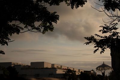 Buildings against cloudy sky