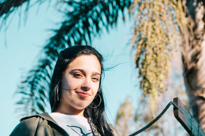 Portrait of woman against plants