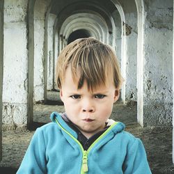 Portrait of boy standing outdoors