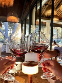 Close-up of hand holding wineglass