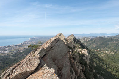 Panoramic view of sea and mountains against sky