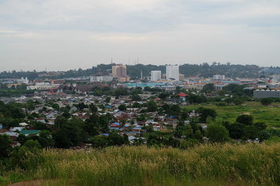 View of city against cloudy sky