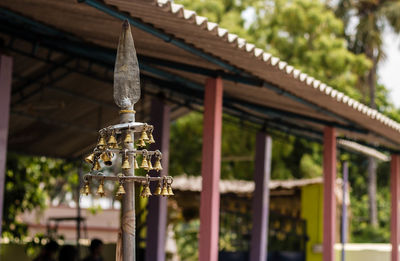 Close-up of bell decoration outside temple