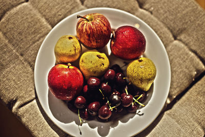 High angle view of fruits in plate on table