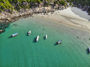 High angle view of boats on sea shore