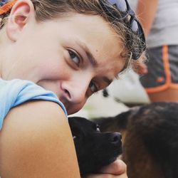 Close-up portrait of woman with dog