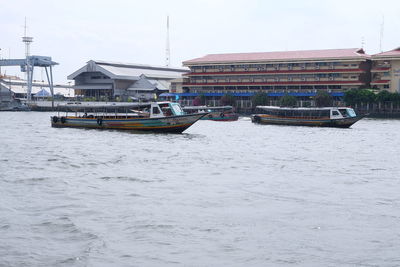 Boats moored in sea