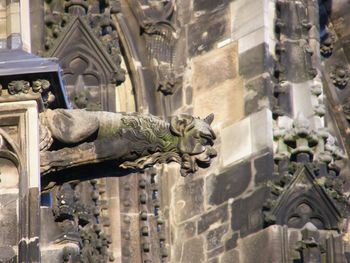 Statue against building