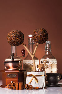 Close-up of coffee beans on table against wall