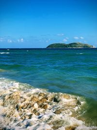 Scenic view of sea against blue sky