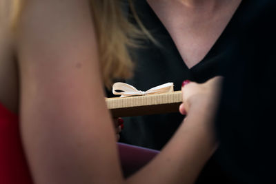 Close-up of woman playing guitar