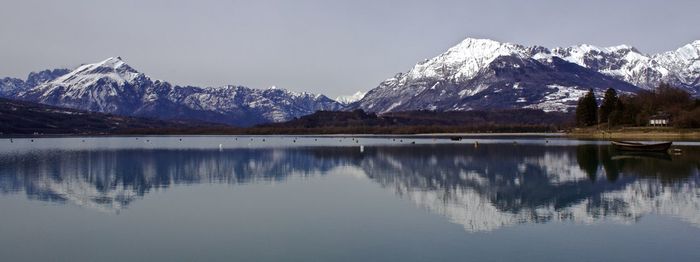 Scenic view of lake with mountains in background