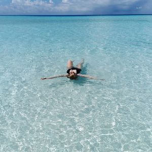 High angle view of woman swimming in pool