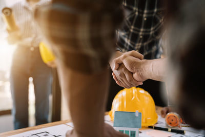 Midsection of man working in office