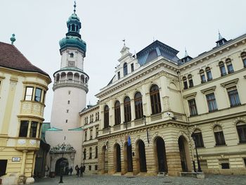 Low angle view of clock tower against sky