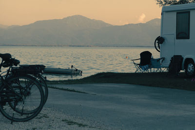 Bicycle by building against sky in city