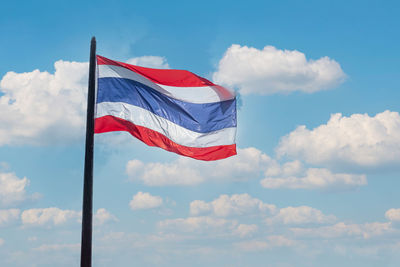 Low angle view of flag against sky