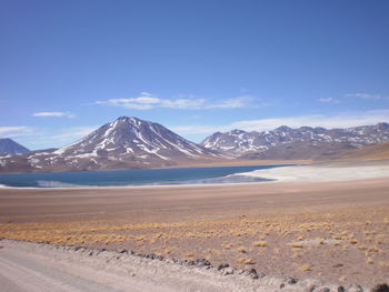 Scenic view of mountains against cloudy sky