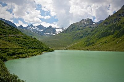 Scenic view of lake against cloudy sky