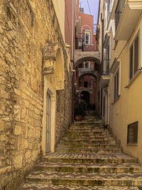 Narrow alley amidst buildings in town