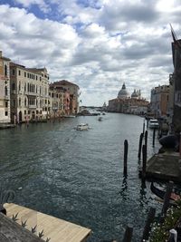 Canal passing through buildings in city