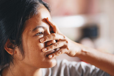 Close-up of thoughtful woman looking away