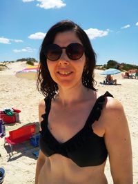 Portrait of smiling young woman on beach