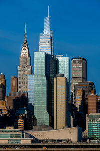 Modern buildings in city against sky