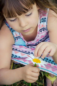 Close-up of girl playing with confetti
