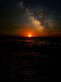 Scenic view of sea against sky at night