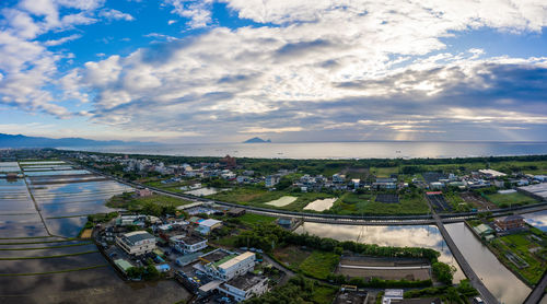 High angle view of buildings in city against sky