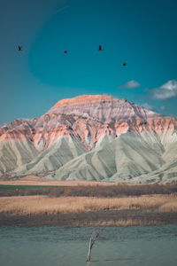 Scenic view of snowcapped mountains against sky