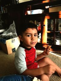 Portrait of smiling boy sitting