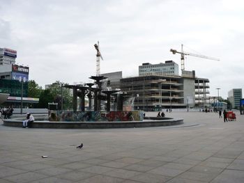 View of buildings against cloudy sky