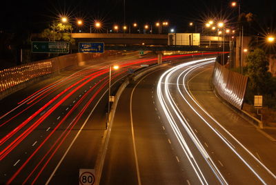 High angle view of light trails on highway at night