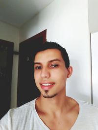 Portrait of young woman at home