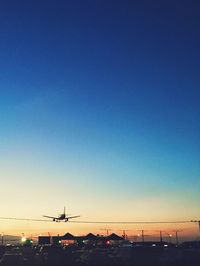 Scenic view of city against clear sky during sunset