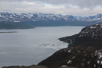 Scenic view of mountains against cloudy sky