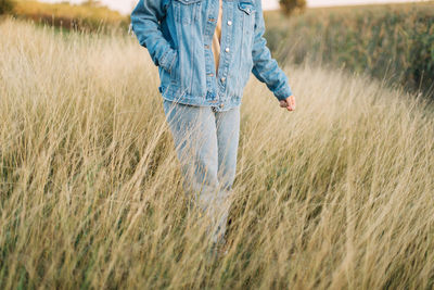 Full length of man walking in field