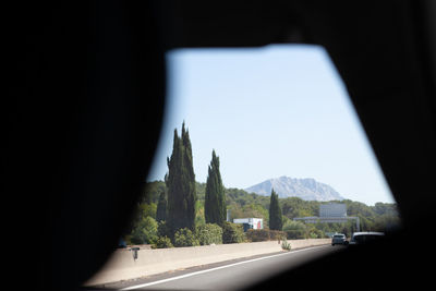 Road seen through car window