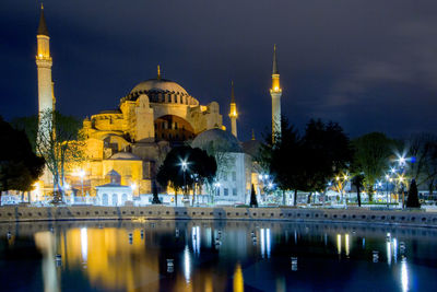 Illuminated cathedral against sky at night