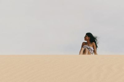 Woman on sand dune