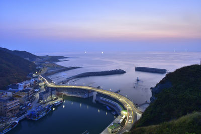 High angle view of bridge over river in city against sky