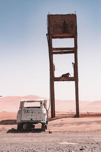 Built structure on desert against clear sky